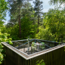 Tree house with terrace in a forest.