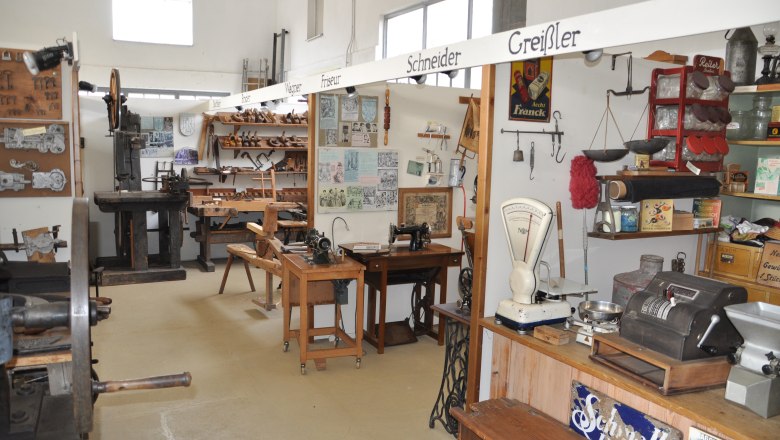 Interior view of a local history museum with old tools and equipment.