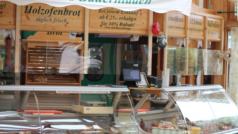 Interior view of a farm store with counter and wood-fired bread.