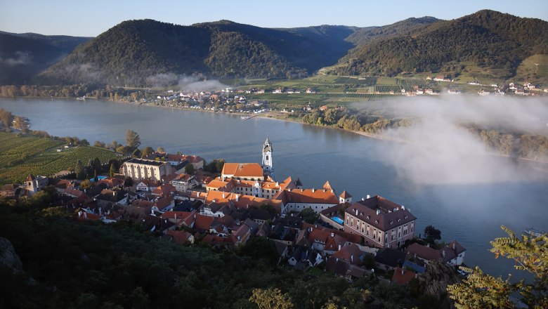 View of Dürnstein with the Danube and morning mist.