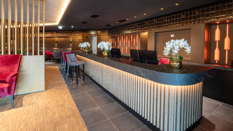 Modern hotel reception with stylish lighting and decoration.