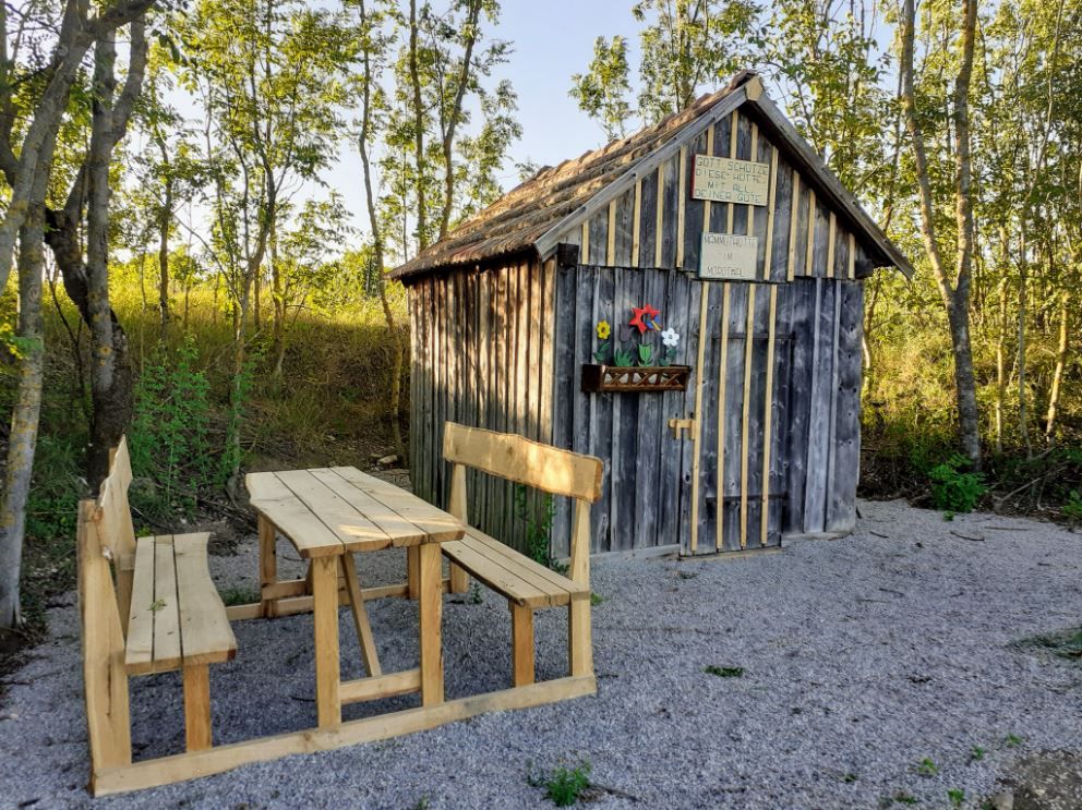 Wooden seating set in the background the mammoth hut