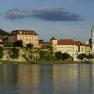 Exterior view of Dürnstein with castle and church on the riverbank.