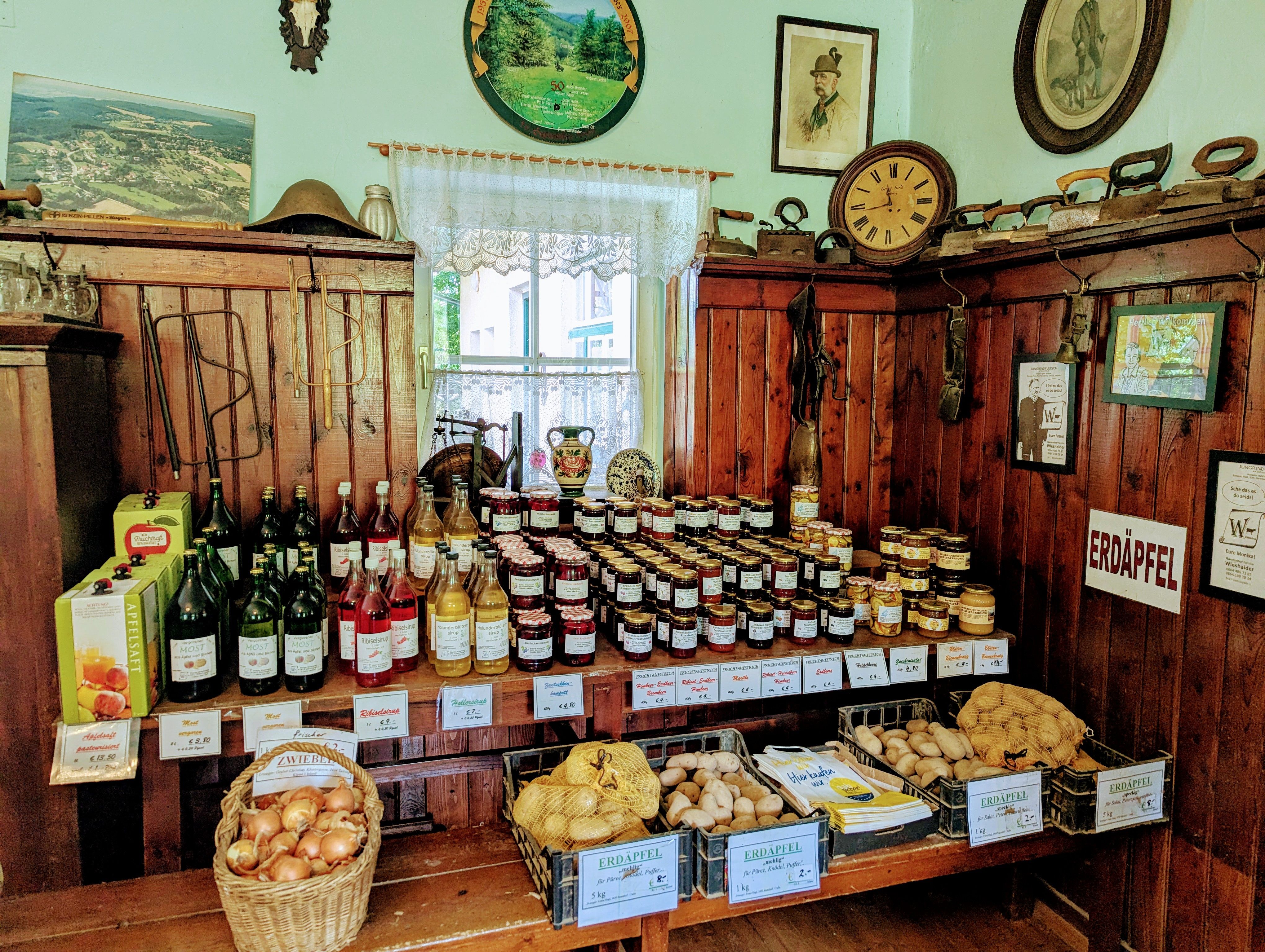 Sales room with regional products such as jams, juices and potatoes.