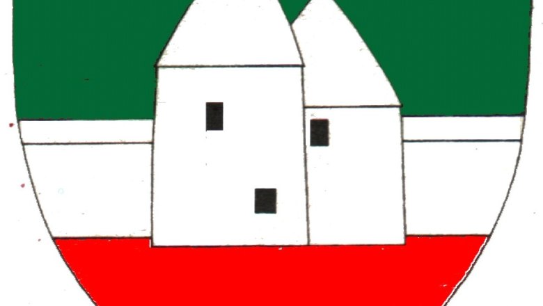 Coat of arms of Pottenstein with green background, white building and red background.