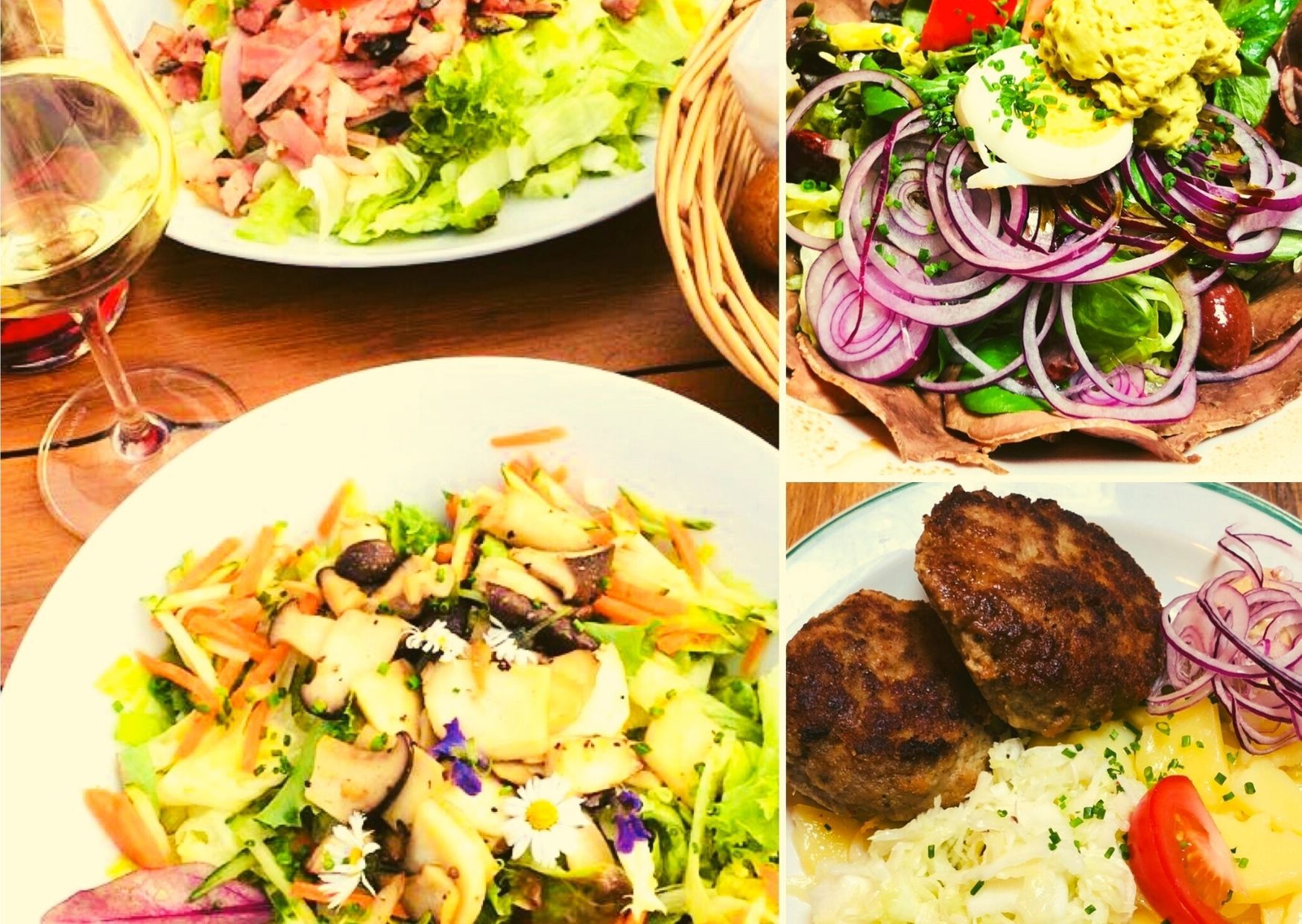 Various plates with salads, meat and a glass of white wine.