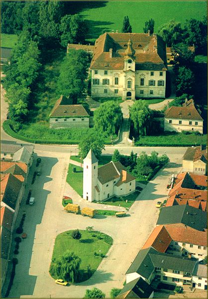 Aerial view of a village with church and castle in Seibersdorf.