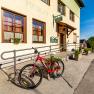 Bicycle in front of Gasthof Pichler on a sunny day.