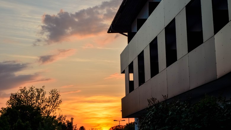 Exterior view of the hotel with sunset