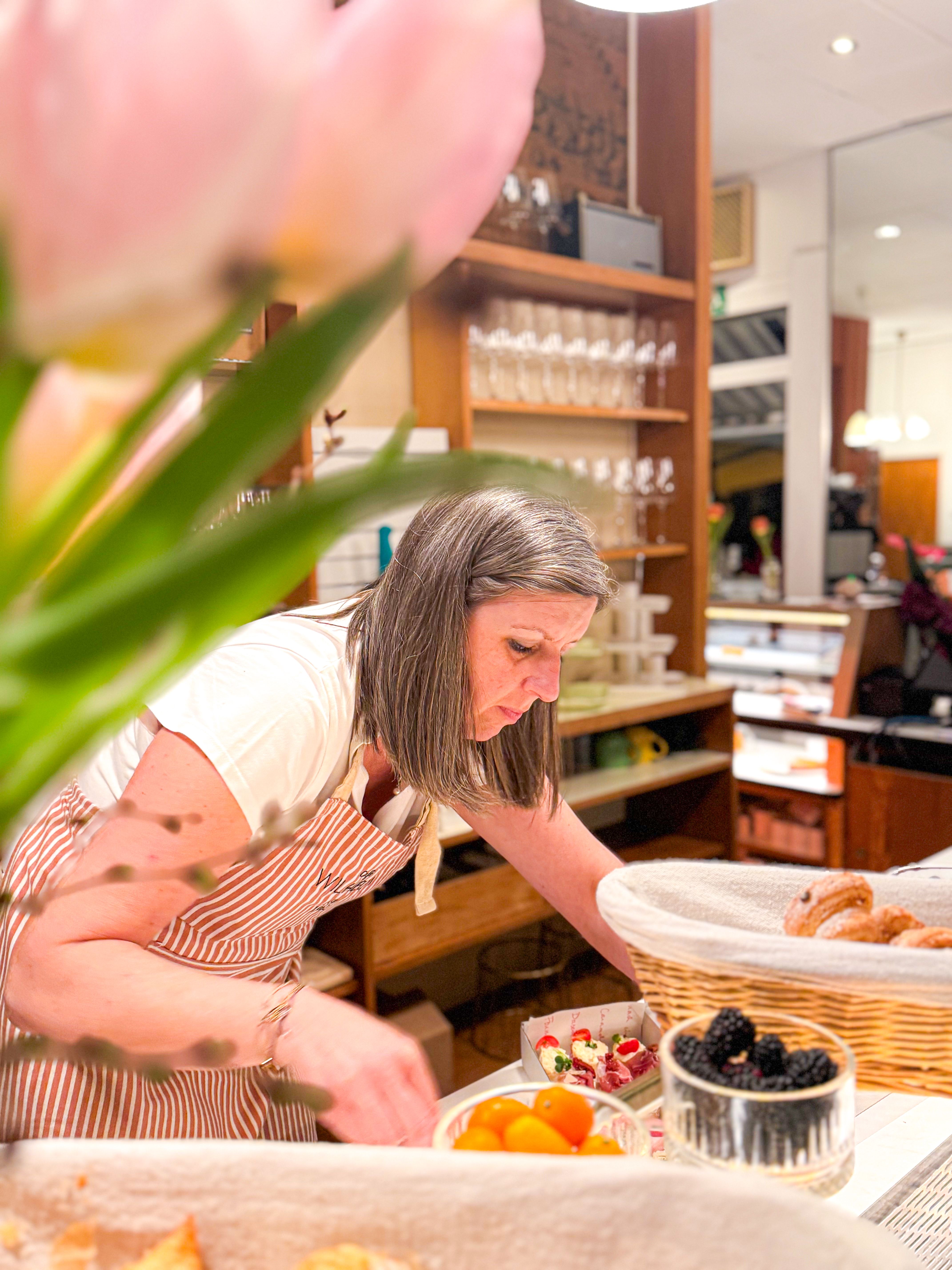 Woman prepares sandwiches