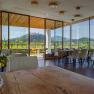 Interior view of a modern restaurant with a view of vineyards.