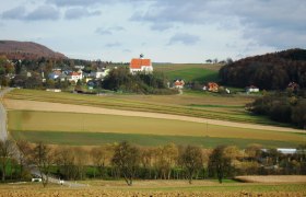Landscape with church and fields in Gerolding, Austria.