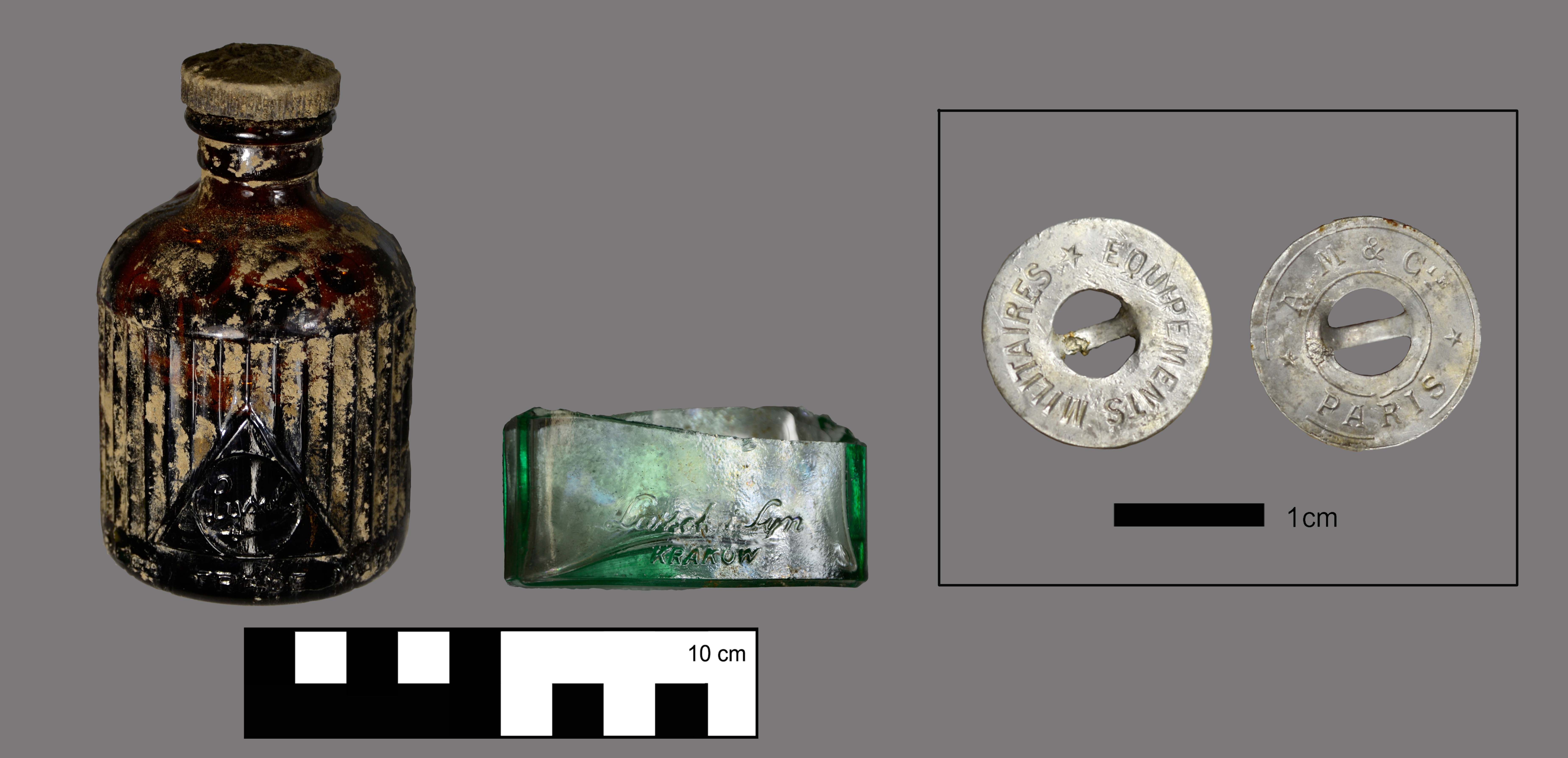 Excavated finds: glass vial and uniform button.
