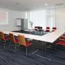 Conference room at the arte Hotel Krems with tables, chairs and presentation equipment.