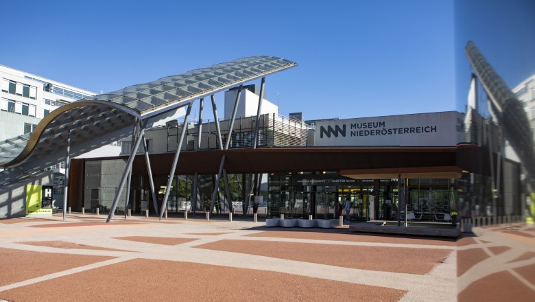 Entrance to the Museum Niederösterreich with modern architecture and glass roof.