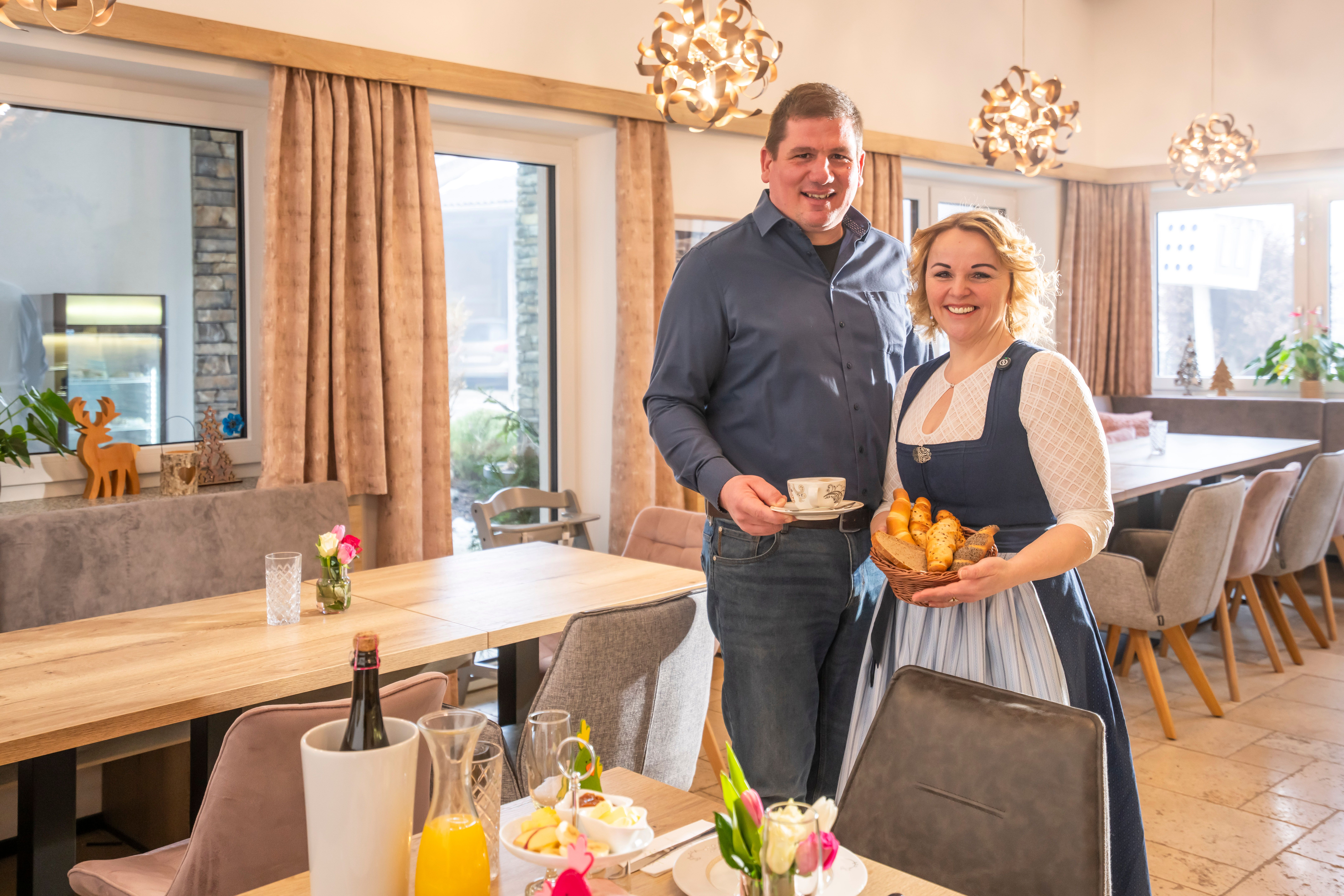 Rene and Maria Harrauer serve coffee and pastries for breakfast at Landhof Harrauer
