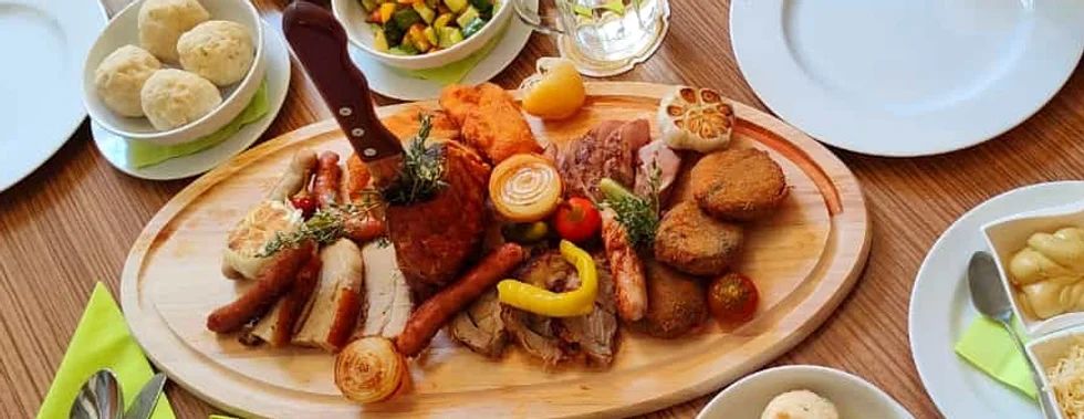 Dish on a wooden board with knife 