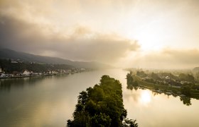 Aerial view of Krummnu&szlig;baum and Marbach at sunrise with river and cloudy sky.