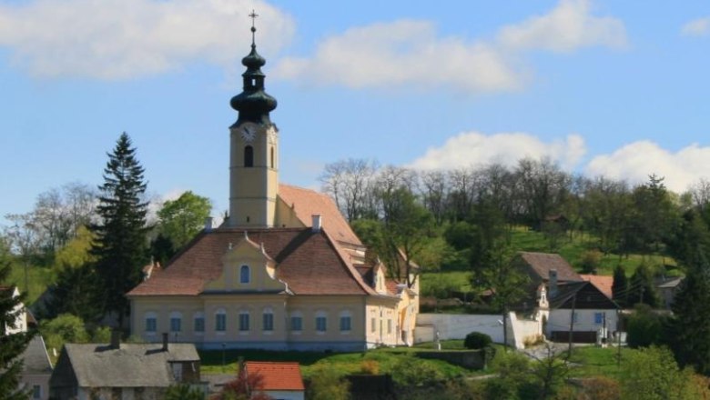 Church in a rural setting with a blue sky.