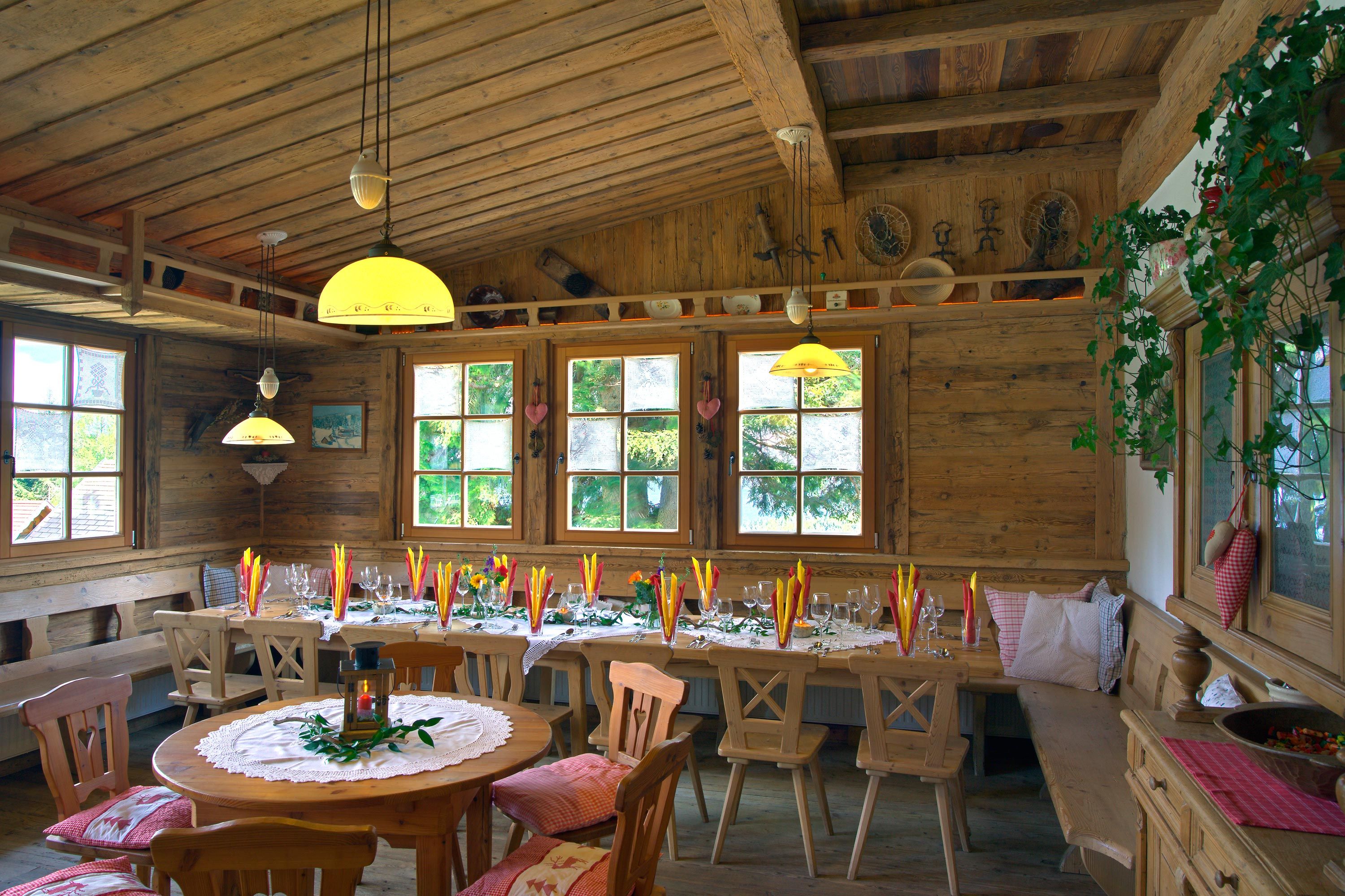 Cozy dining room with wooden furniture and decorated table.