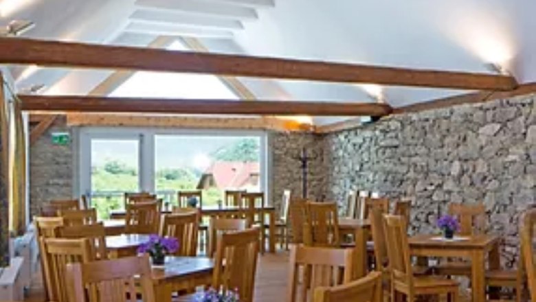 Dining room with wooden tables and chairs