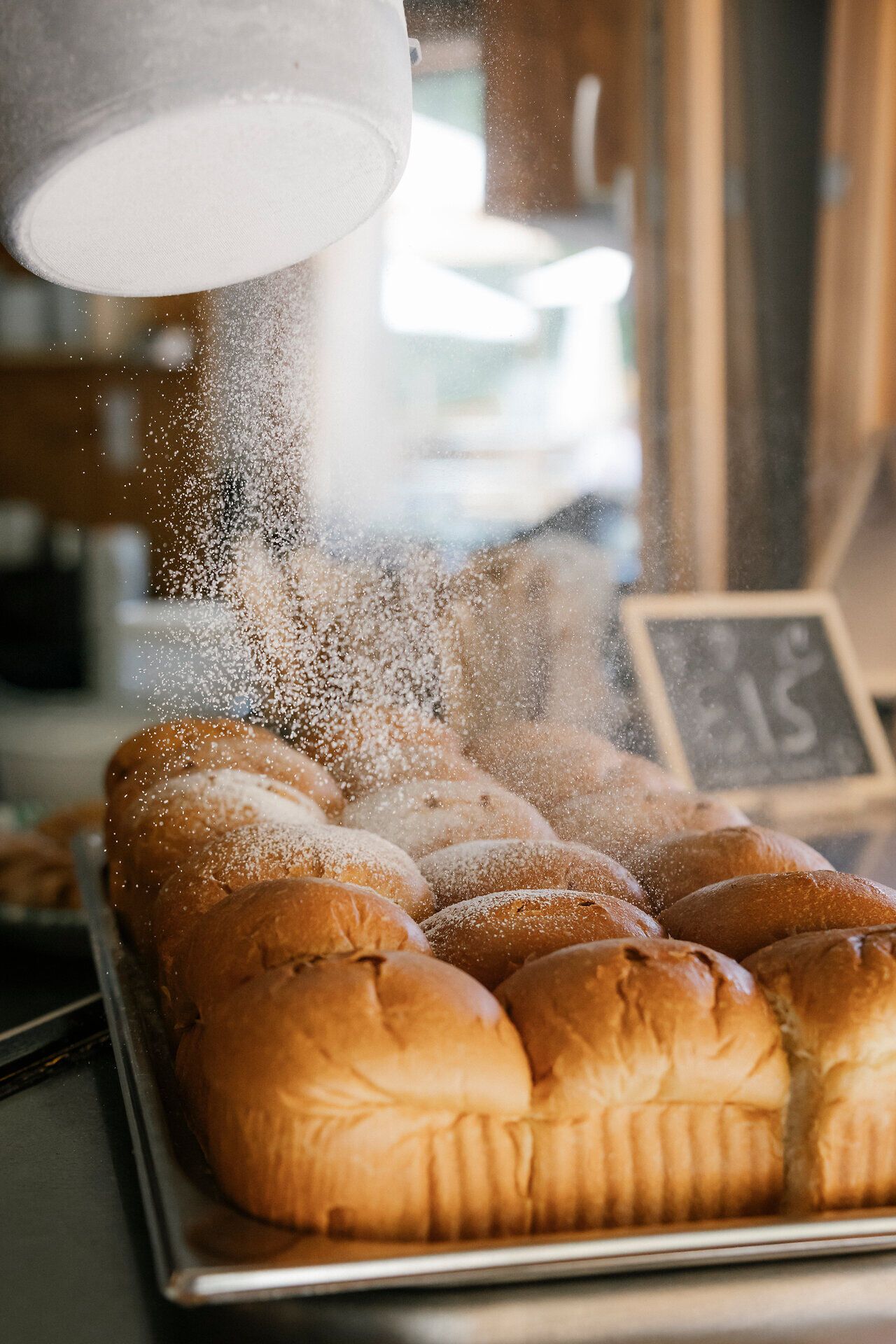 Freshly baked Buchteln are sprinkled with powdered sugar
