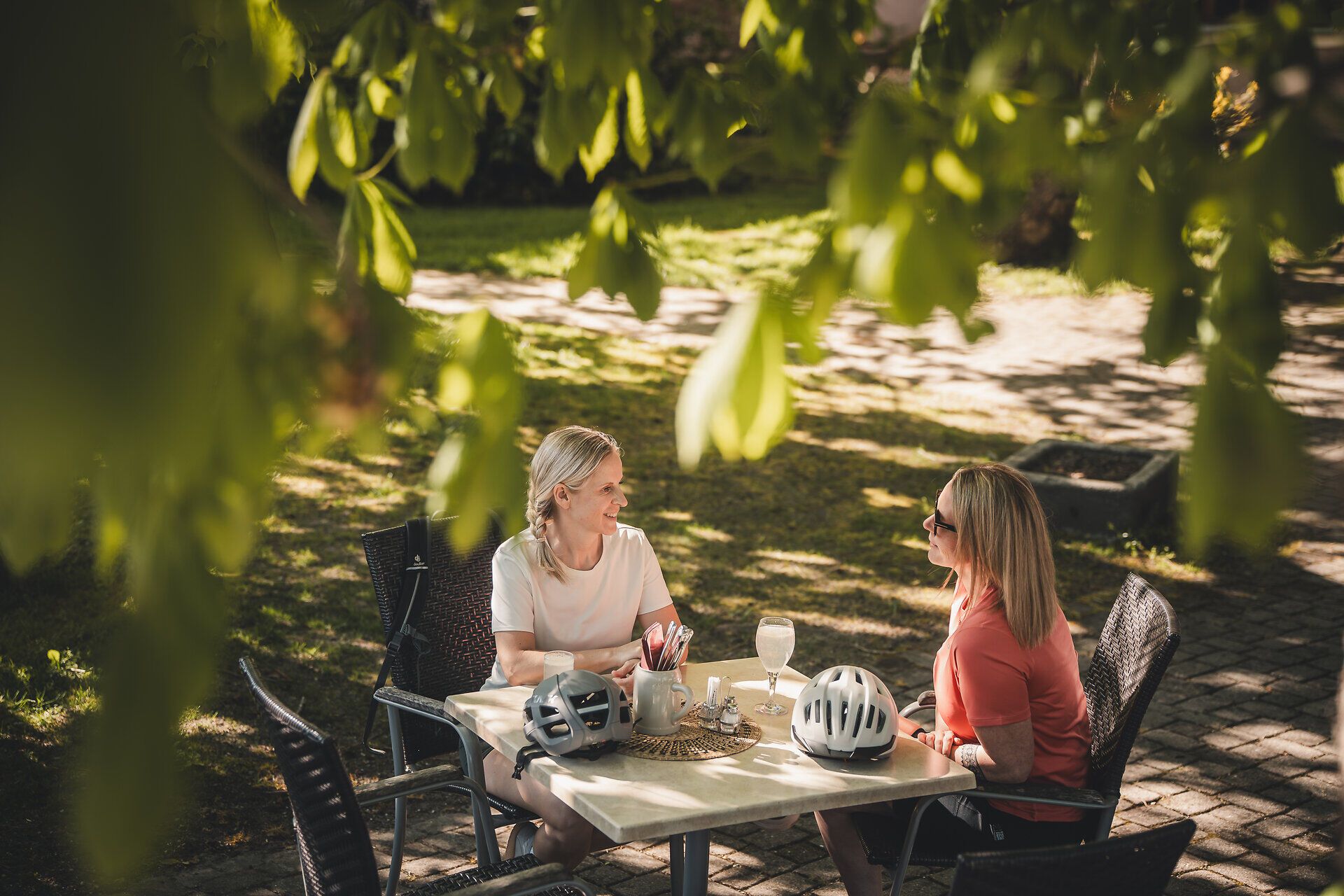 Two women take a break from cycling.