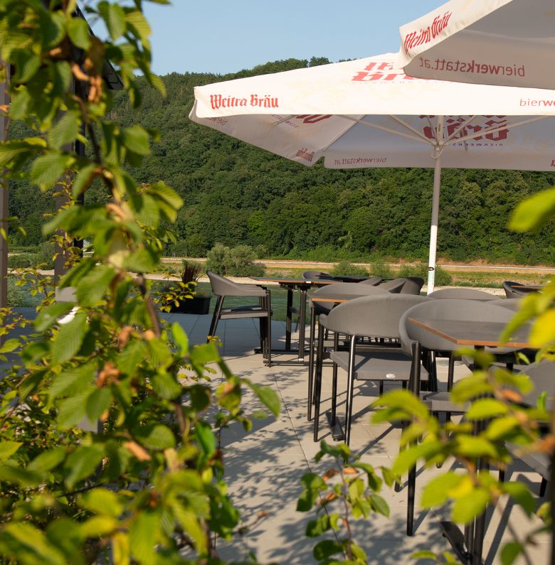 Tables on the terrace with green plants
