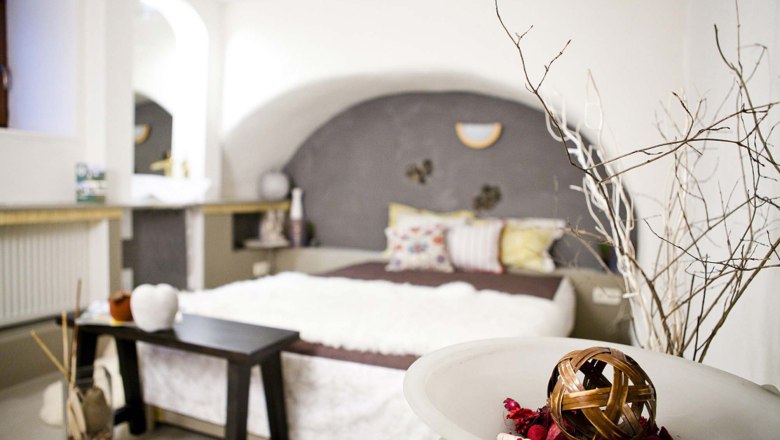 Cozy bedroom with decoration and bed.