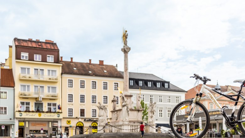 Town square with fountain, bicycle in the foreground, Hotel Zentral in the background.