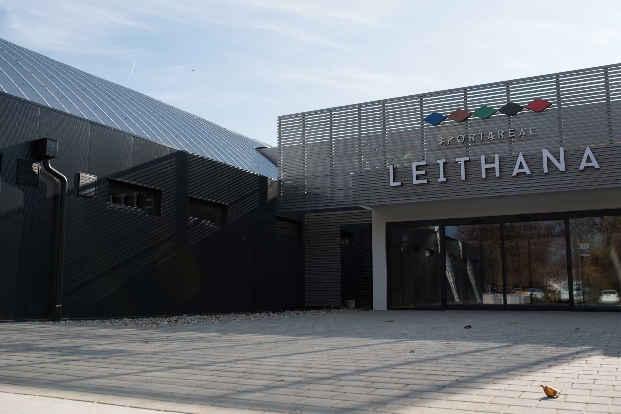 Entrance to the Leithana sports area with modern architecture and glass front.