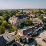 Aerial view of Oberstockstall Estate with historic buildings and green surroundings.