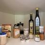 Storage cupboard with spices, oils and coffee.
