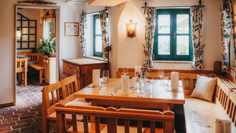 Cozy dining room with wooden furniture and table setting.