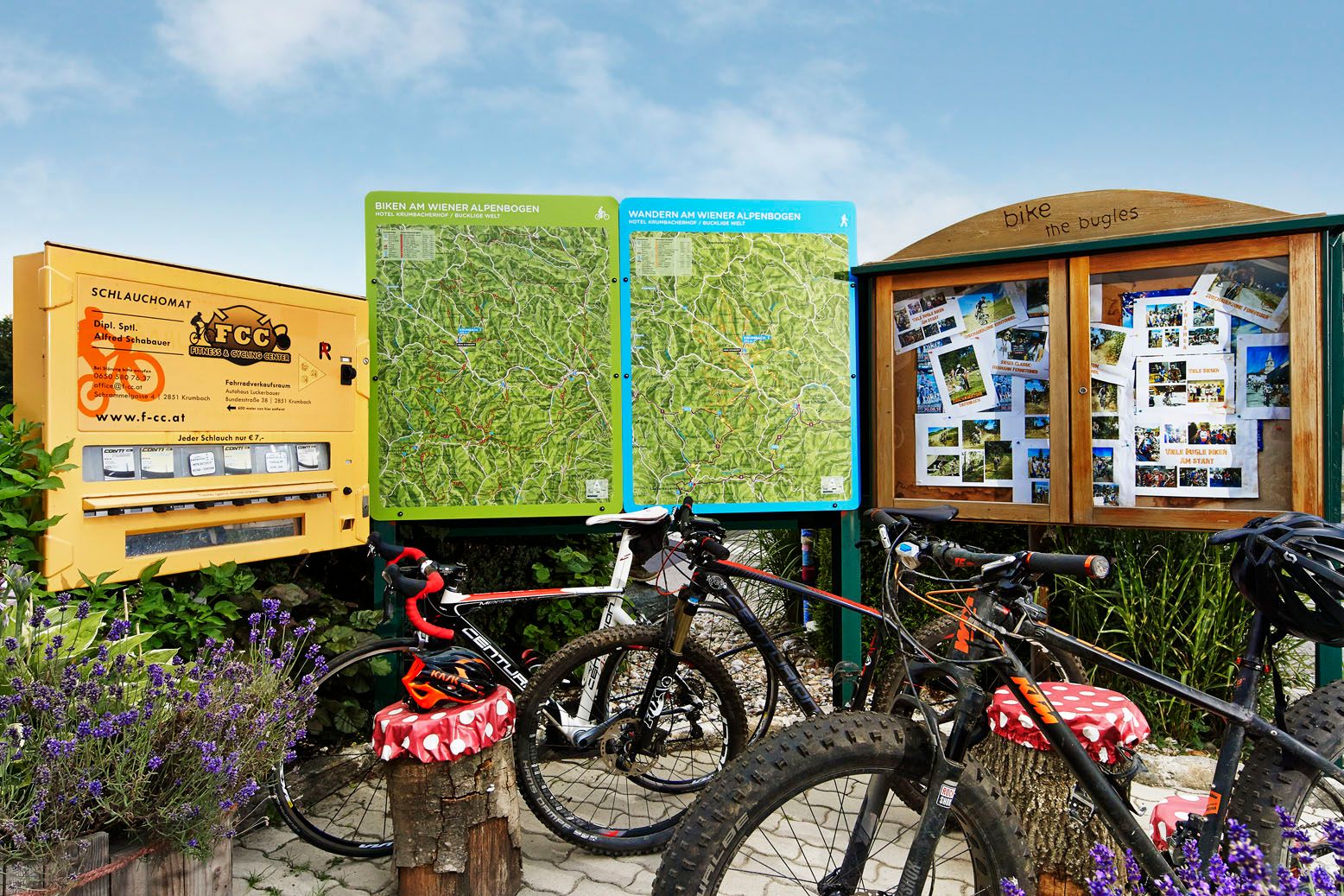 Bicycles in front of information boards with hiking and cycling trails in the Vienna Alps.