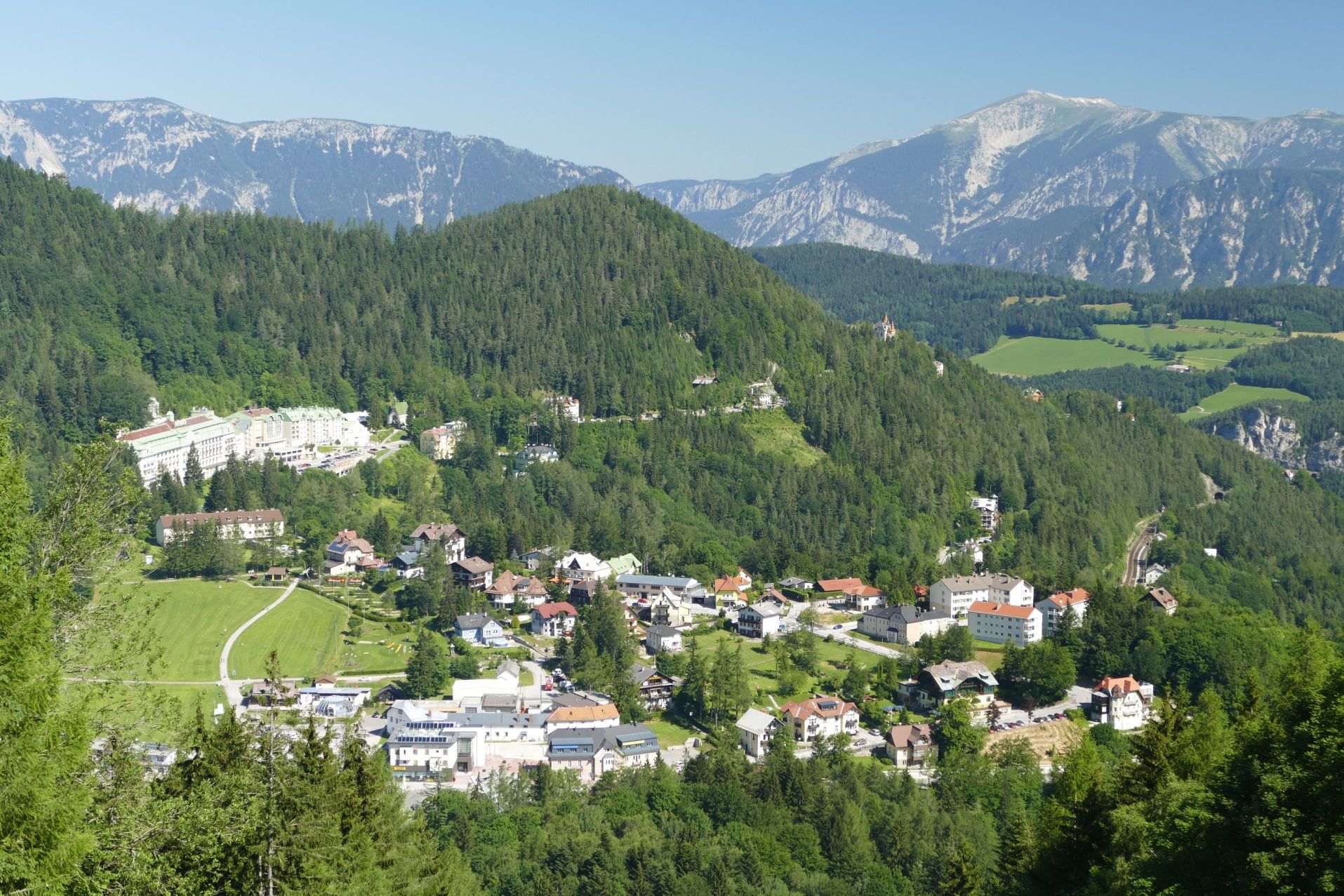 Panoramic view of the Semmering with mountains and forest.