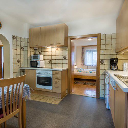 Kitchen with stove and microwave