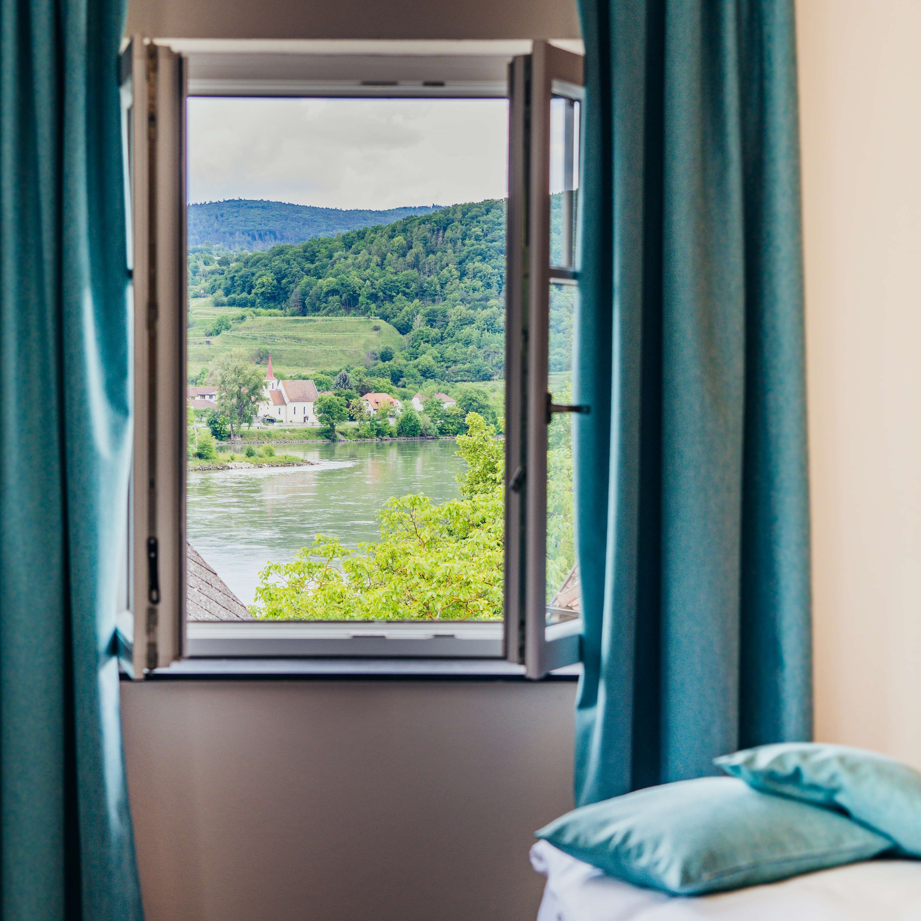 View of the river and hills from a bedroom window.