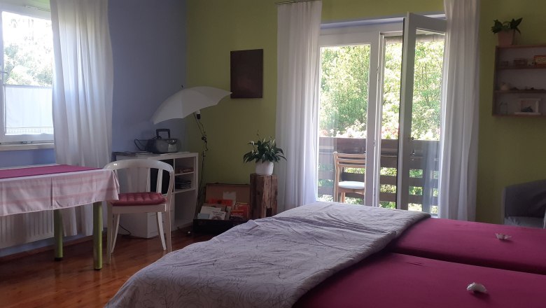 Comfortable double room with balcony and natural light.