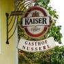 Sign of the Gasthof Nusserl with Kaiser Bier logo.