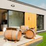 Modern terrace with wine barrel furniture in front of an apartment.