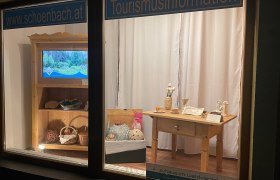 Shop window with tourist information and handmade products.