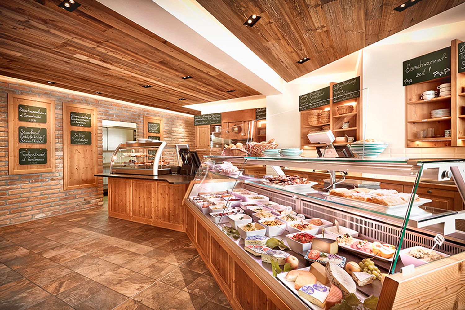 Interior view of a wine tavern with bar and food.