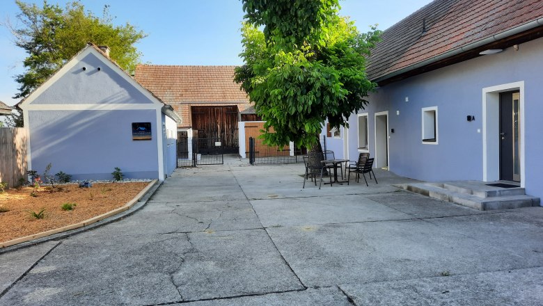 Blue farmhouse with inner courtyard