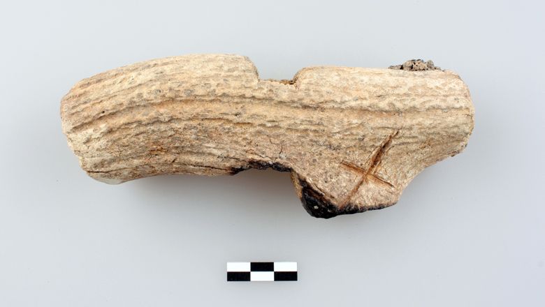 Late Bronze Age hammer made from deer antler with an incised X.