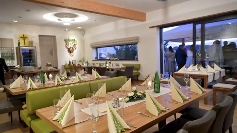 Elegant tasting room with laid tables and decoration.