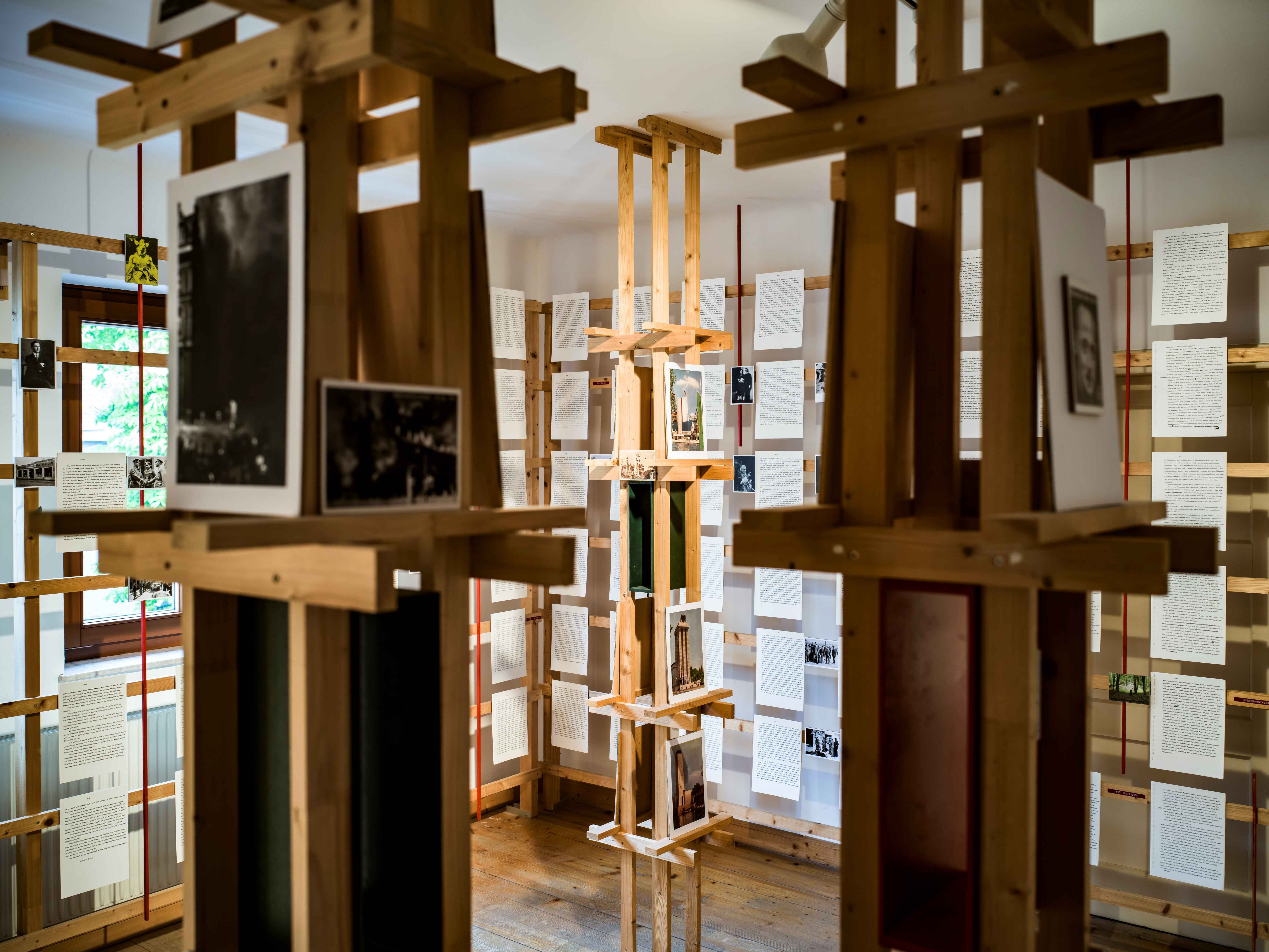 Interior view of the Erlauf Peace Museum with wooden installation and documents on display.