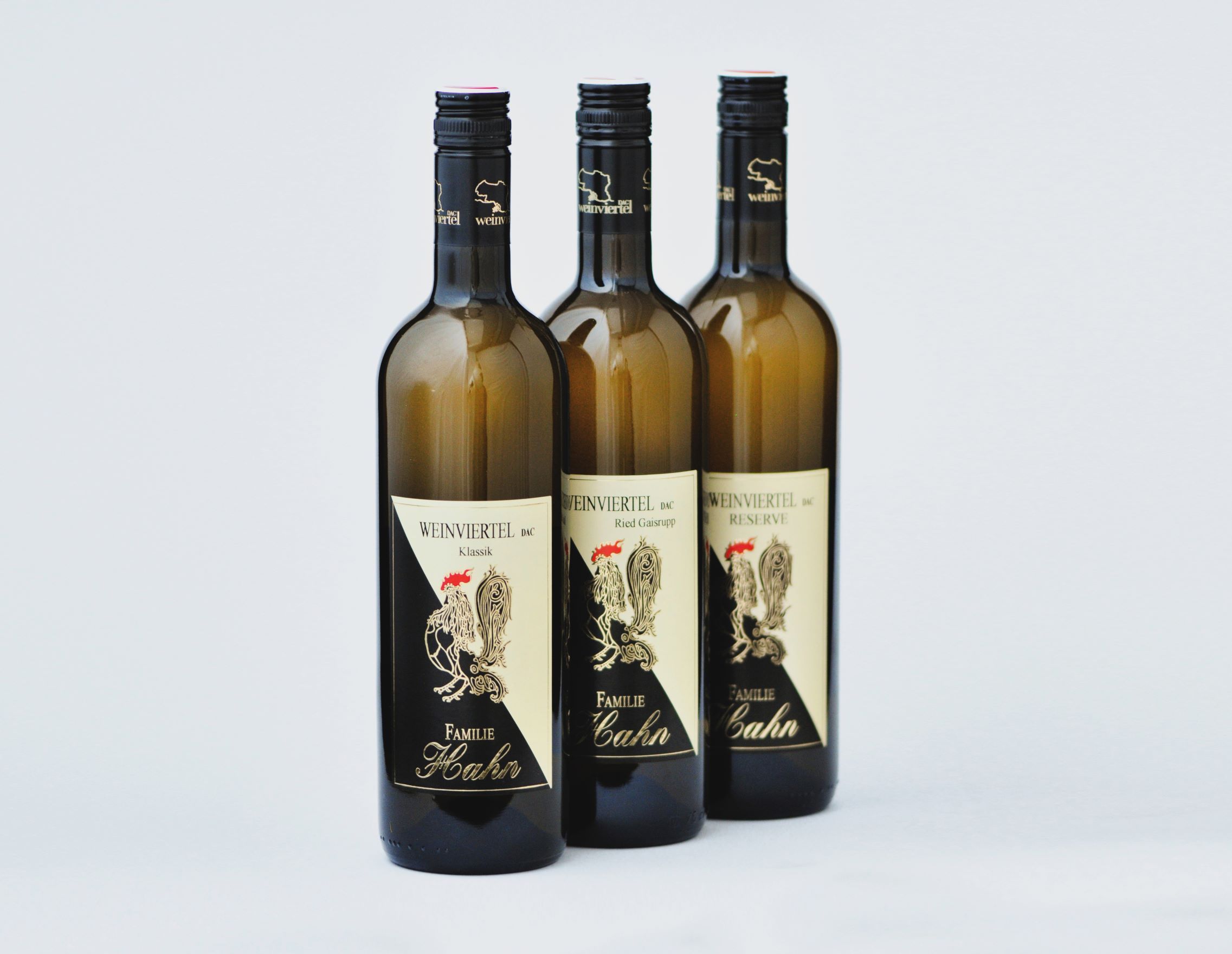 Three bottles of wine from the Hahn winery on a white background.