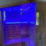 Infrared cabin with blue lighting in a bathroom.