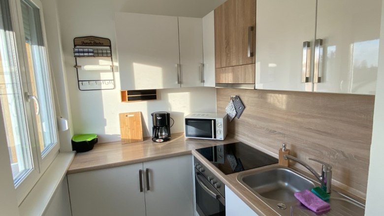 Bright kitchen with window and electrical appliances